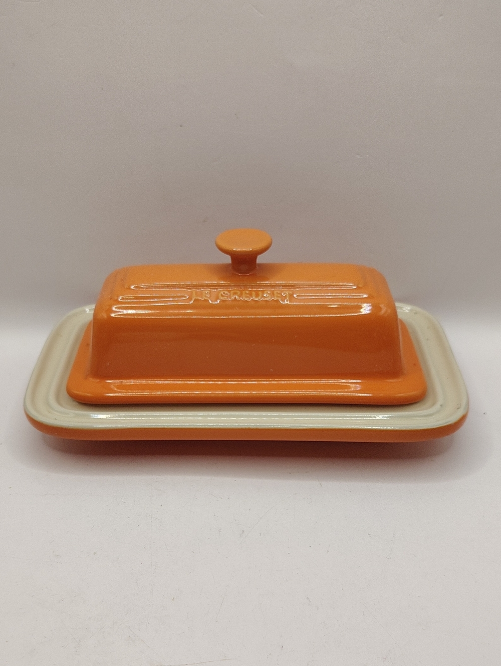 Le Creuset Bright Orange Stoneware Butter Dish. New